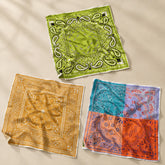 Calvéra Bandana Set – Pack of 3 placed on a light beige surface