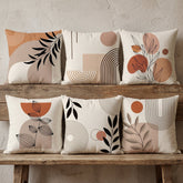 Six neutral cushion covers with terracotta abstract shapes and black botanical details.