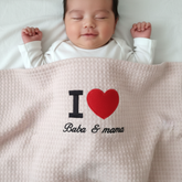 Baby lying on a blanket with 'I ❤️ Baba & mama' text