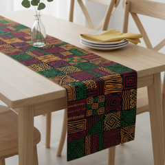 Multicoloured geometric patchwork-pattern table runner on a light dining table.