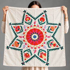Heritage Starburst Scarf a silk scarf is holded by a model