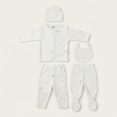 A baby clothing set laid flat on a light cream background, including a long-sleeve button-front top, matching footed pants, a bib, and a small hat. The garments are white with tiny scattered pastel animal prints.