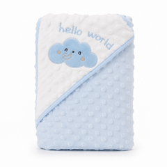 A folded baby blanket with a white and light blue minky dot design, featuring an embroidered blue cloud with a smiling face and the words 'hello world' on the white section.
