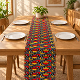 Red, yellow and navy diamond-pattern table runner with matching placemats.