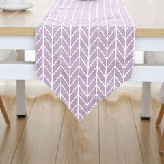 Lavender table runner with white chevron lines.