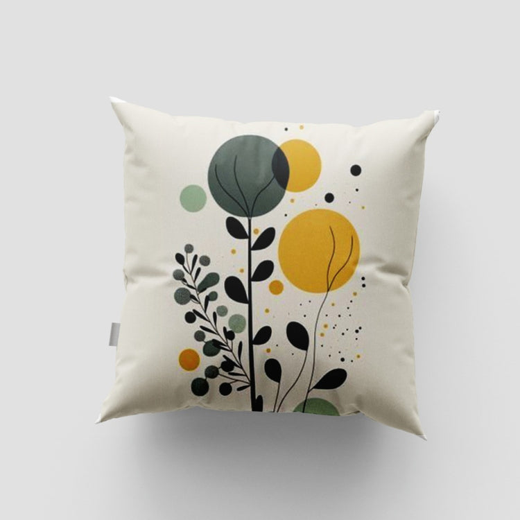 Cream cushion cover with black botanical stems and green and yellow circles.