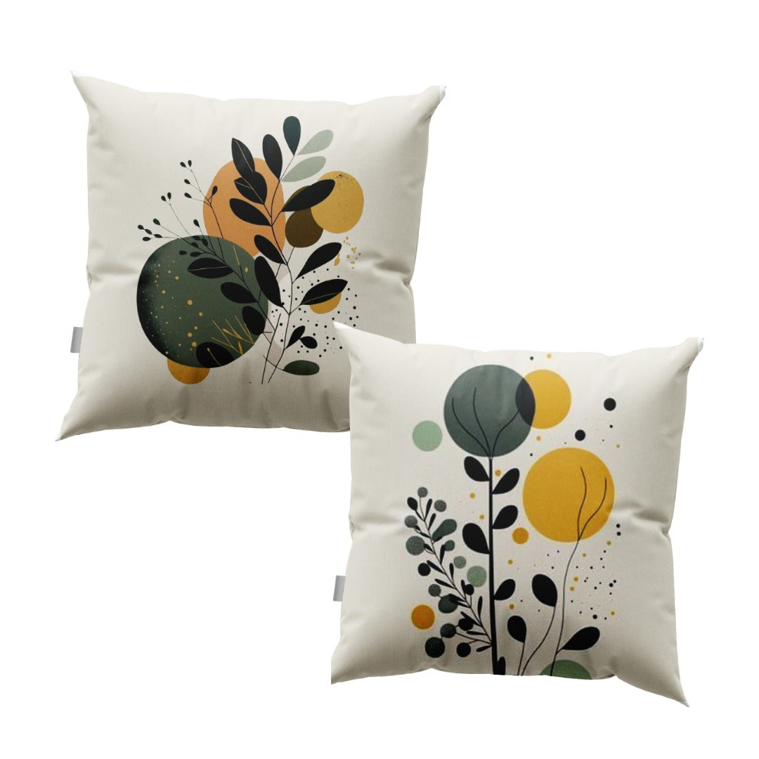 Two cream cushion covers with black leafy stems over green and mustard circles.