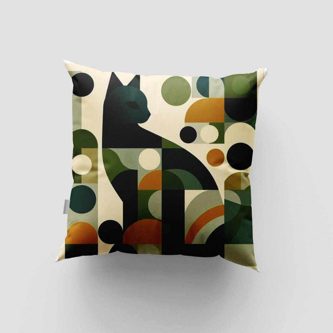 Cushion cover with a geometric cat silhouette amid green, black and mustard shapes.
