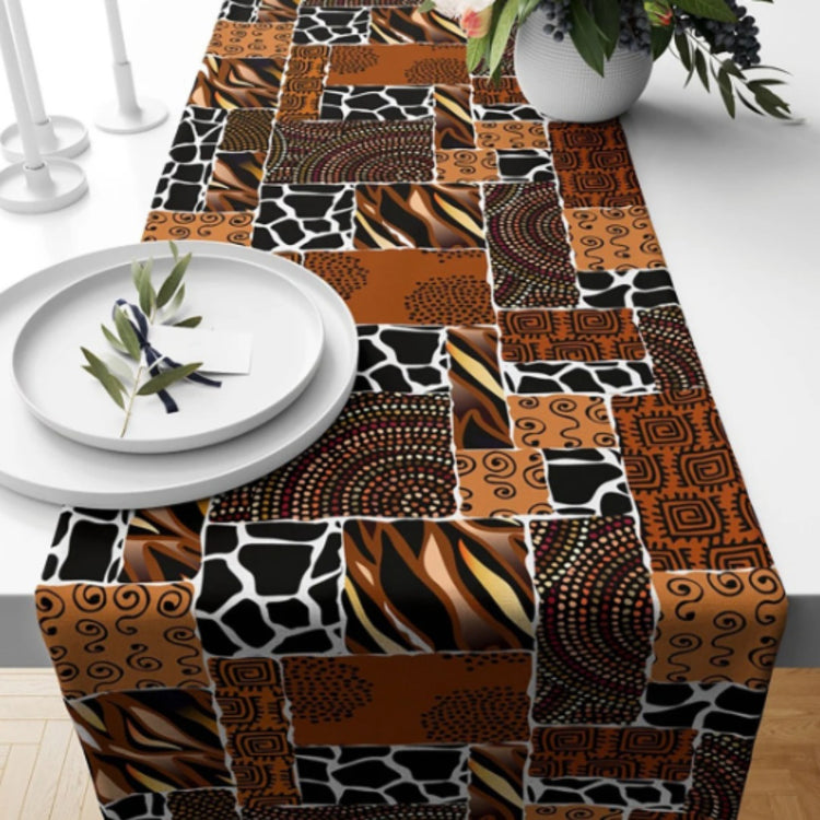 Brown patchwork-pattern table runner with animal-print and geometric panels.