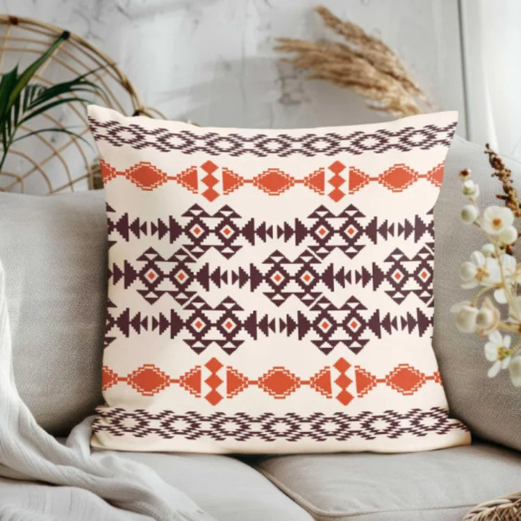 Cream cushion cover with horizontal rust and brown diamond and line patterns.
