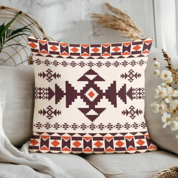Cream cushion cover with a large dark brown diamond and rust patterned borders.