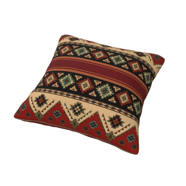 Rust and black cushion cover with horizontal bands of cream and mustard geometric motifs.