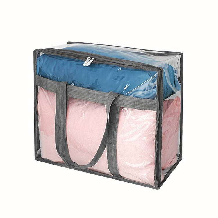 Clear rectangular zippered storage bag with gray trim and long handles holding bedding
