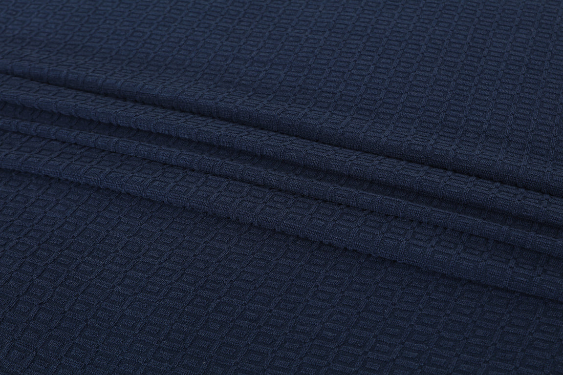 Close-up of navy cotton thermal blanket fabric.