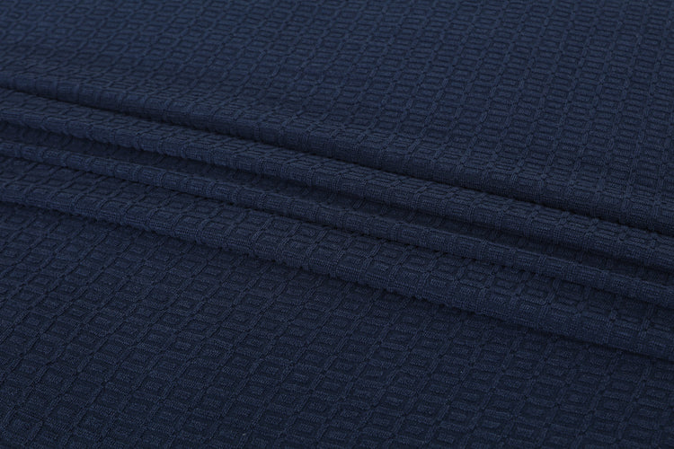 Close-up of navy cotton thermal blanket fabric.