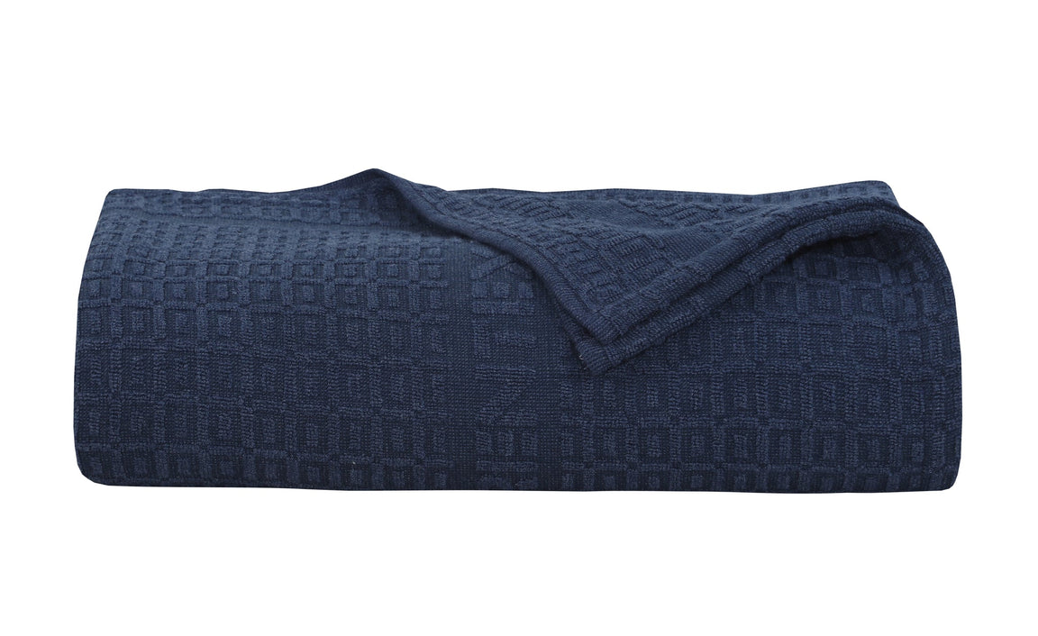 Folded navy cotton thermal blanket.