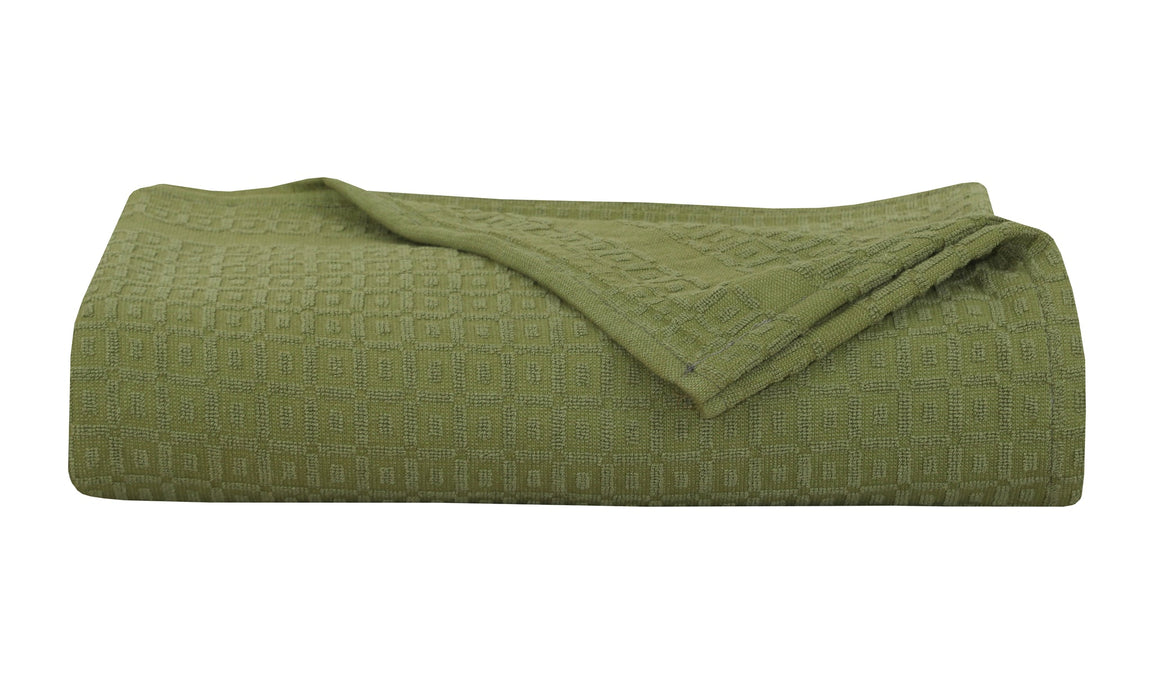 Folded olive green cotton thermal blanket.
