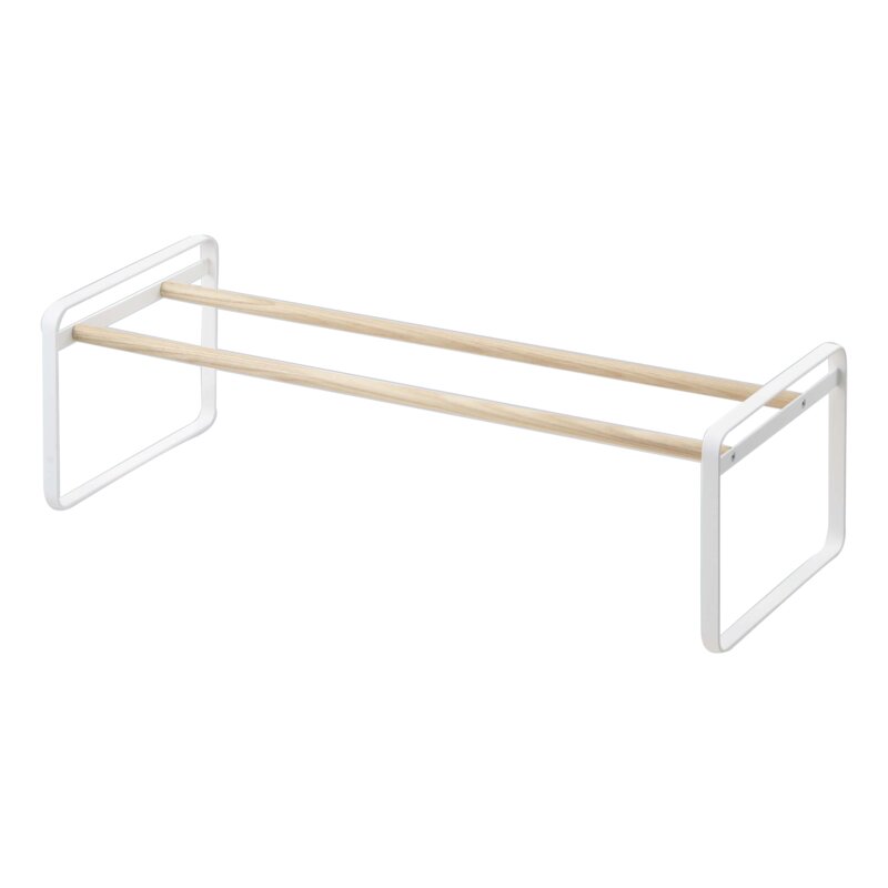Empty low white shoe rack with two wood-tone rails