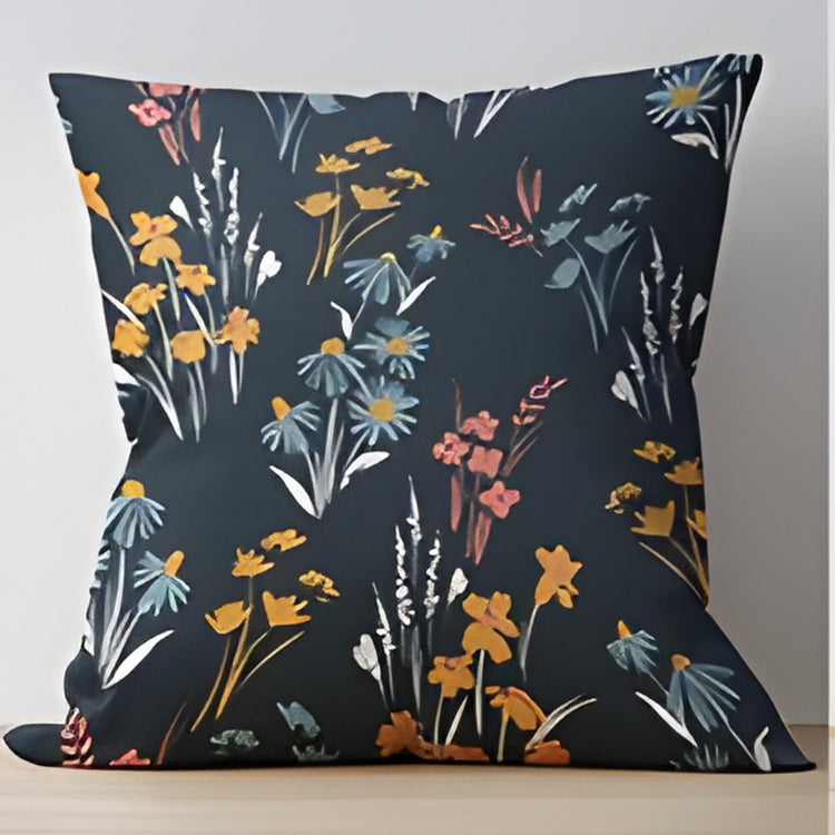 Dark blue cushion cover with delicate yellow, white and pink wildflowers.