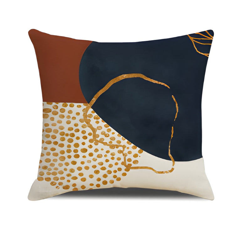 Cushion cover with navy and rust panels, a gold coloured loop and a dotted cream corner.
