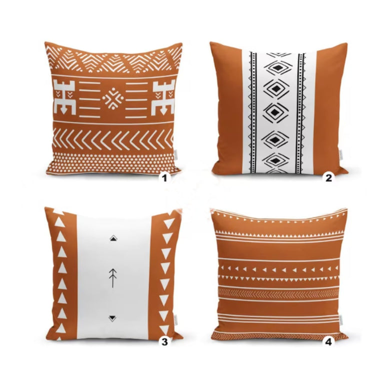 Four rust and white cushion covers with stripes and small geometric motifs.
