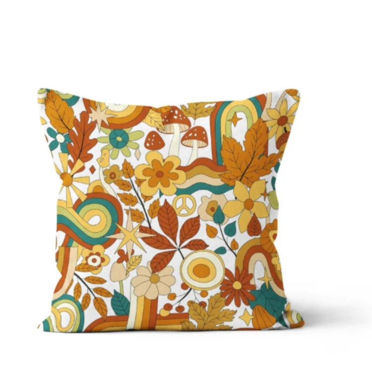 Cream cushion cover with dense orange, green and mustard flowers and leaves.