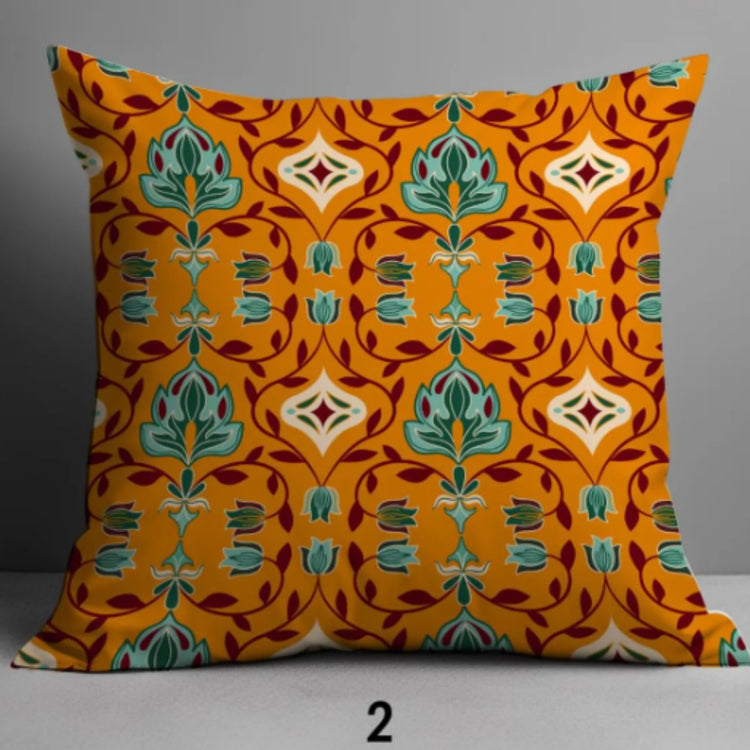 Orange cushion cover with repeating teal, cream and dark ornamental motifs.
