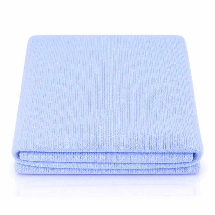 Folded light blue ribbed blanket showing its layered edges.