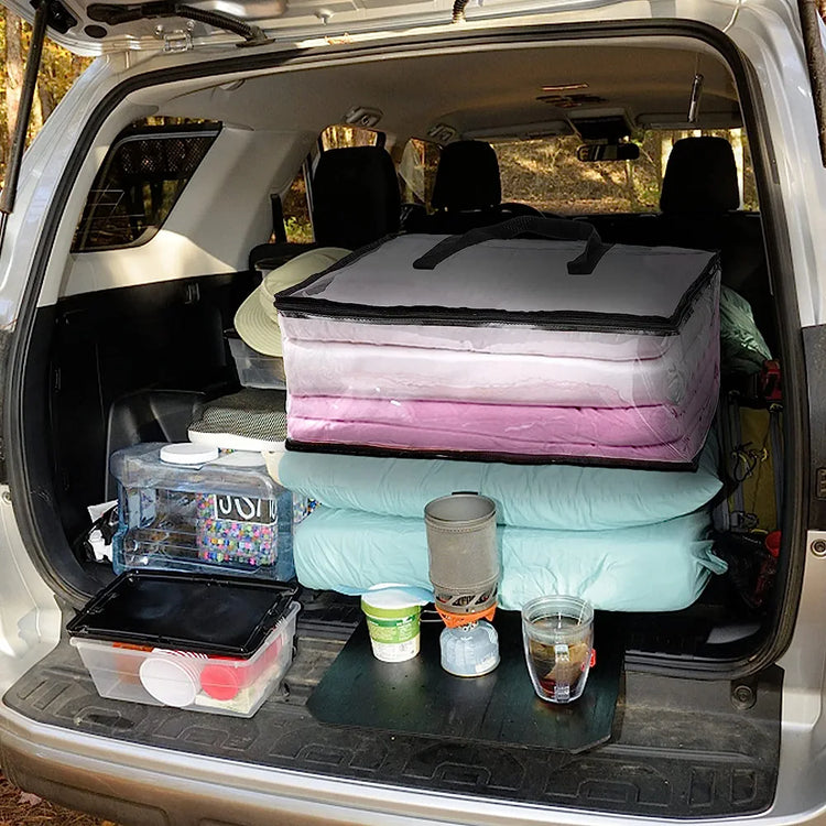 Bedding-storage bags packed inside a car boot.