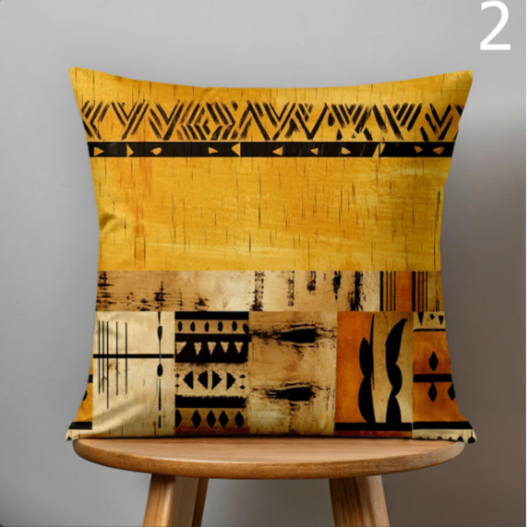 Mustard cushion cover with black geometric borders and abstract horizontal panels.