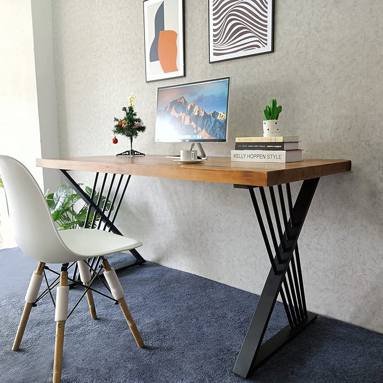 Brown-top desk with black crossed leg supports holding a computer beside a white chair.