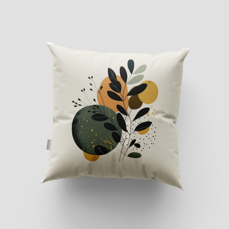 Cream cushion cover with a black leafy branch over green and ochre abstract circles.