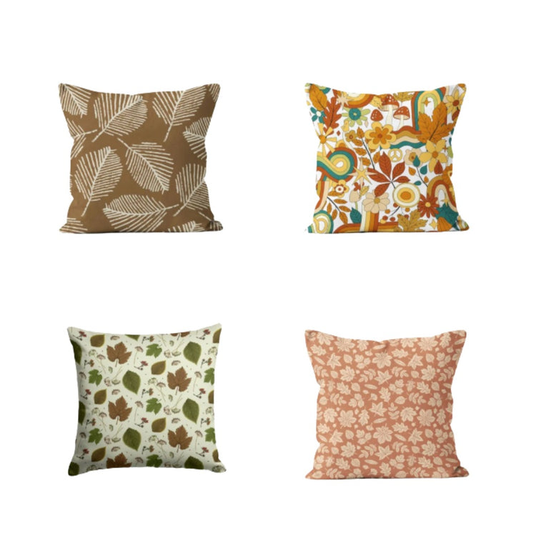 Four cushion covers with autumnal leaf and floral patterns.