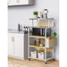Light wood-tone rolling kitchen rack with white frame, microwave and side storage pocket