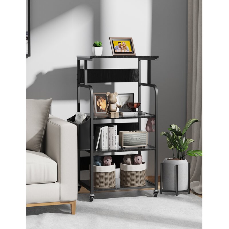 Black shelving cart with rounded side rails displaying books and decorative objects