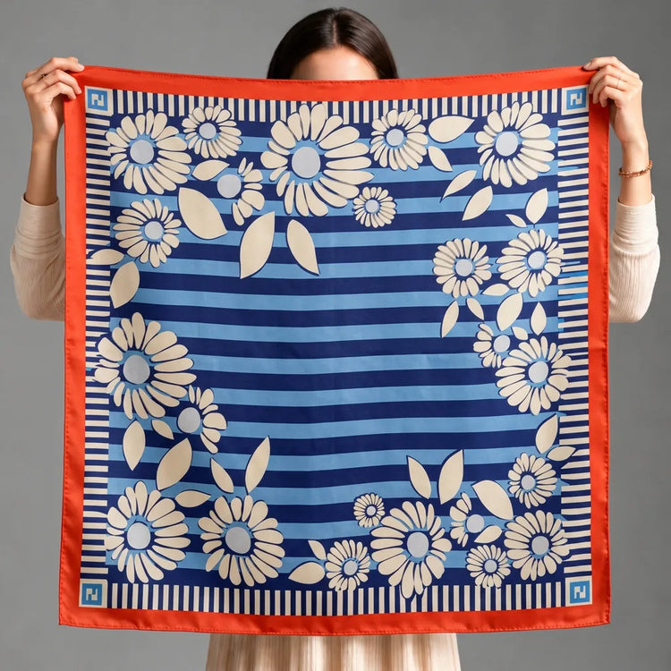 a silk holded by a women while showing the esign clearly 
