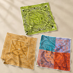 Calvéra Bandana Set – Pack of 3 placed on a light beige surface 