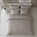 Grey striped bedding set viewed from above on a bed.