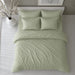 Sage green striped bedding set viewed from above on a bed.