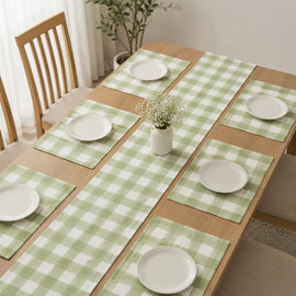 Sage green and cream checked table runner with matching placemats.