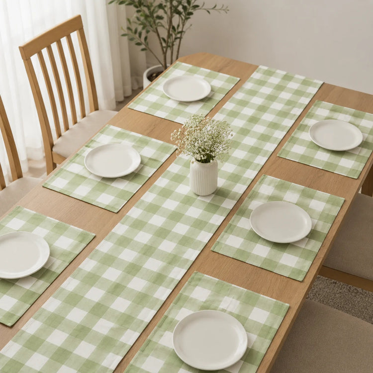 Sage green and cream checked table runner with matching placemats.