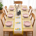 Cream table runner with yellow flowers, green leaves and matching placemats.