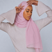 Model wearing a plain pale pink chiffon stole as a headscarf.