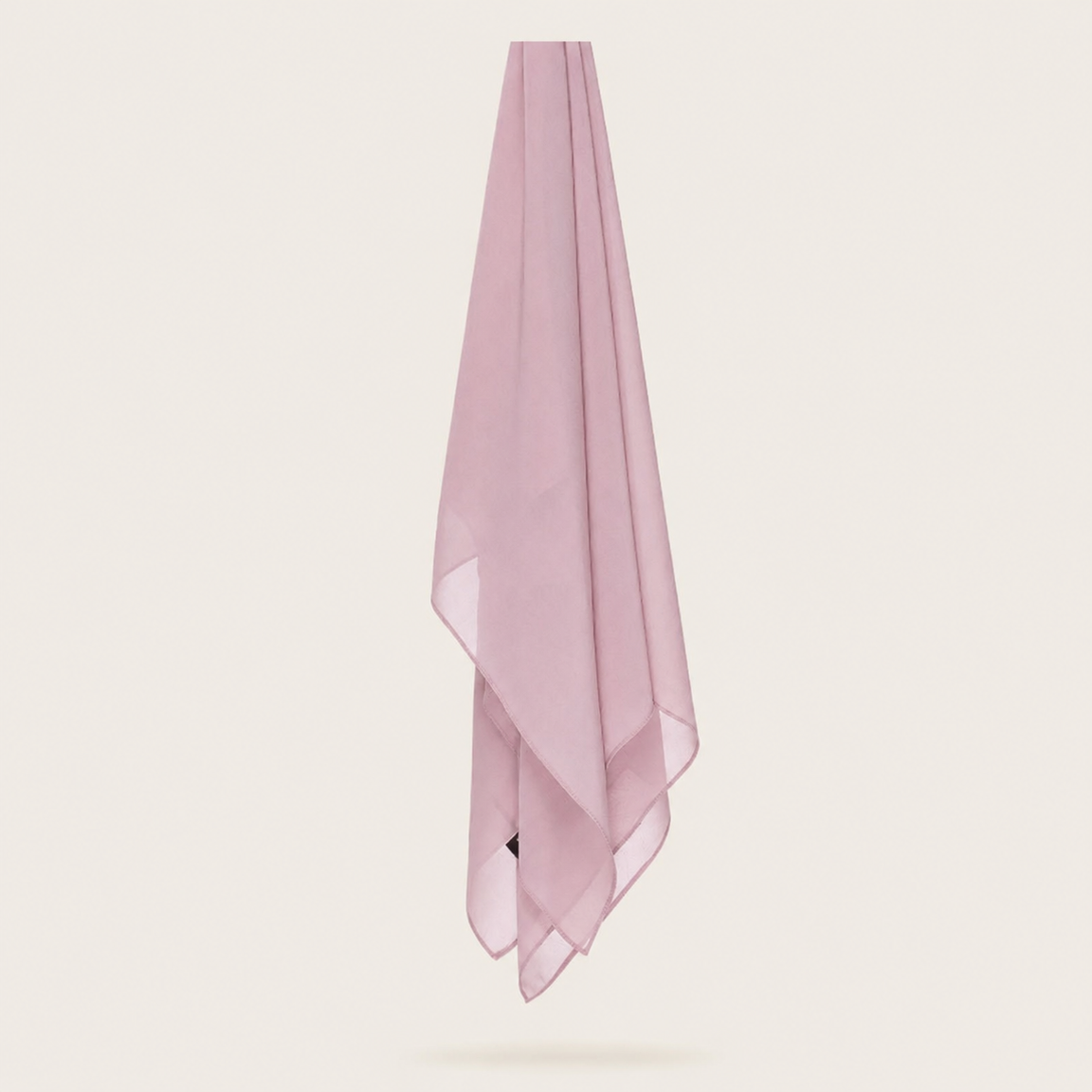 Pale pink chiffon stole hanging vertically to show its light fabric.