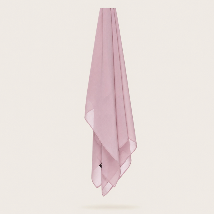 Pale pink chiffon stole hanging vertically to show its light fabric.