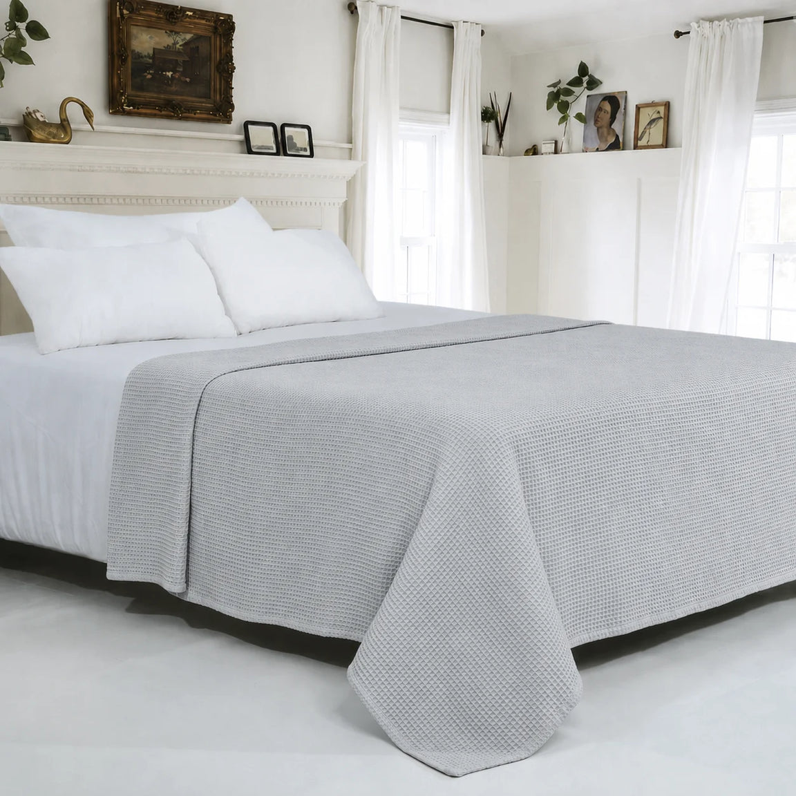 Light grey textured cotton thermal blanket spread across a bed.