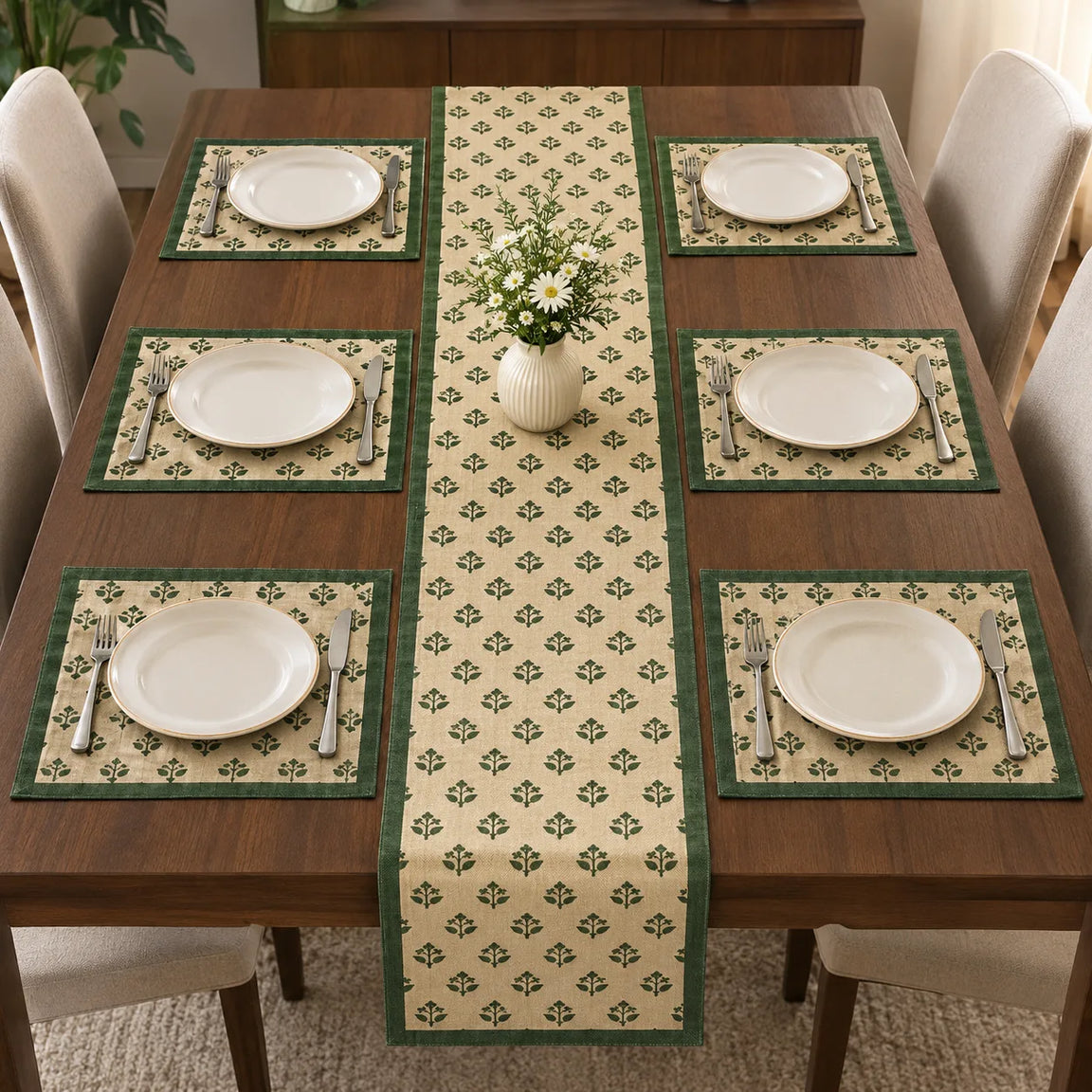 Alt Text: Wooden dining table set with white plates and cutlery, featuring a cream-colored table runner covered in a small, repeating green botanical clover pattern and solid dark green side borders.  with 6 mats 