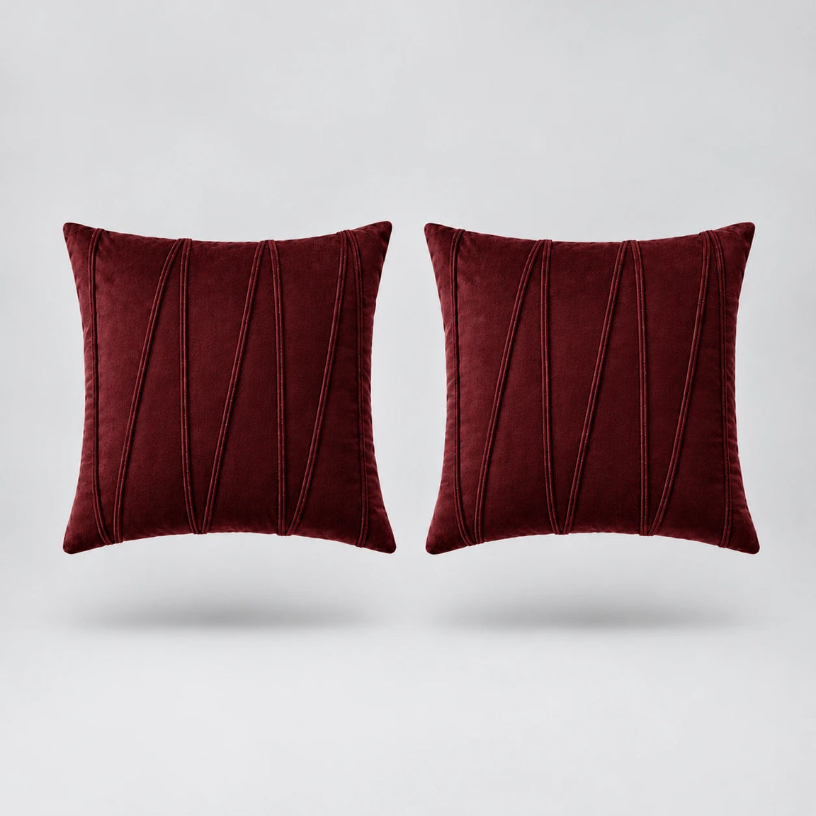 Embroidered V Velvet Cushion Cover Pack Of 2 floating on a light grey surface