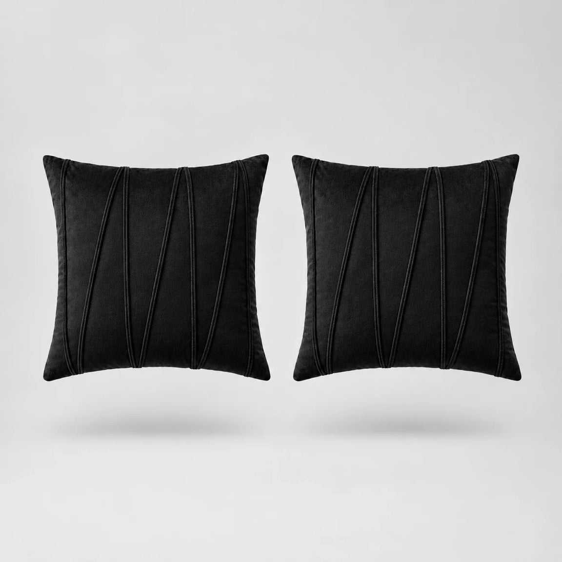 Embroidered V Velvet Cushion Cover Pack Of 2 floating on a light grey surface