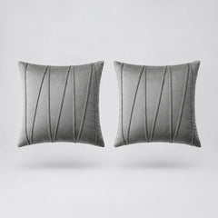 Two square gray throw pillows with vertical pleated detailing, shown side by side on a light gray background.